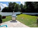 Spacious, fenced backyard featuring a stainless steel grill and well-maintained lawn at 1288 Shenandoah Cir, Rock Hill, SC 29730