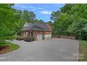 Spacious three-car garage with a large driveway, offering ample parking and convenience at 1317 Longleaf Ct, Matthews, NC 28104