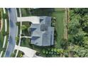 A bird's eye view of a home with a large roof, driveway, and well-kept lawn at 1908 Masons Bend Dr, Fort Mill, SC 29708