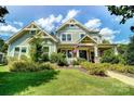 Beautiful two-story home featuring a covered front porch at 1908 Masons Bend Dr, Fort Mill, SC 29708