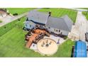 Expansive backyard deck and stone fire pit area offer lots of room for entertaining guests at 250 Wesley Amaker Rd, York, SC 29745