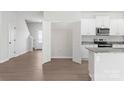 Bright, modern kitchen with stainless steel appliances, granite countertops and spacious pantry at 3315 Burberry Dr, Gastonia, NC 28052