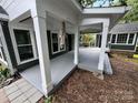 Spacious covered porch with ample room for outdoor seating and relaxation at 4221 Hounds Run Dr, Matthews, NC 28105