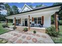 Charming front porch with decorative stone pathway and welcoming decor at 4592 Reid Rd, Edgemoor, SC 29712