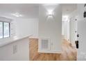 Bright living area featuring hardwood floors and neutral walls, offering a clean and modern aesthetic at 4806 Spring Lake Dr # D, Charlotte, NC 28212
