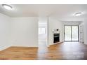 The living area has wood floors, a fireplace, and an adjacent room visible at 4806 Spring Lake Dr # D, Charlotte, NC 28212