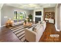 Bright living room with a modern fireplace, recessed lighting, and elegant striped rug at 5003 Tremont Dr, Indian Trail, NC 28079