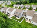 An aerial view of the backyard featuring a white fence and a cozy patio area at 5069 Thomasville Dr, Belmont, NC 28012