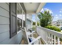 Inviting front porch with rocking chairs, perfect for relaxing and enjoying the outdoors at 5069 Thomasville Dr, Belmont, NC 28012