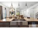 Modern kitchen featuring a stainless steel farmhouse sink and stylish countertops at 5069 Thomasville Dr, Belmont, NC 28012