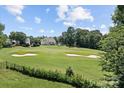 Scenic view of the golf course and backyard at 615 N Oak Dr, Huntersville, NC 28078