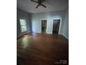 Cozy bedroom with hardwood floors, natural light, and neutral walls at 716 N Fulton St, Salisbury, NC 28144