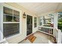Welcoming front porch featuring a stylish entry door, sidelight windows, and a 'Welcome' mat at 8310 Brickle Ln, Huntersville, NC 28078
