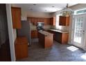 Well-equipped kitchen with stainless steel appliances, granite countertops, and an island at 9228 Old Barnette Pl, Huntersville, NC 28078