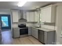 Modern kitchen featuring stainless steel appliances, granite countertops and subway tile backsplash at 11021 Scrimshaw Ln, Charlotte, NC 28215