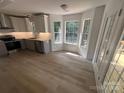 Bright kitchen featuring wood floors, recessed lights, stainless steel appliances, and plenty of windows for natural light at 11021 Scrimshaw Ln, Charlotte, NC 28215