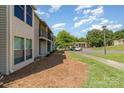A serene exterior perspective reveals the property's proximity to ample parking and the building's architectural design at 11049 Cedar View Rd, Charlotte, NC 28226