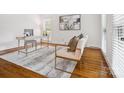 Bright home office with hardwood floors and stylish furniture at 1140 Iverleigh Trl, Charlotte, NC 28270