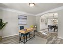 Cozy office space with desk, stylish chair, and view to dining room at 19010 Oakhurst Blvd, Cornelius, NC 28031