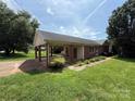 Charming single story brick house with well-manicured lawn and attached covered carport at 2547 Nc 182 Hwy, Lincolnton, NC 28092