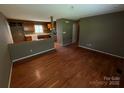 Open concept living room with hardwood floors offering seamless transition to the adjacent kitchen at 2547 Nc 182 Hwy, Lincolnton, NC 28092