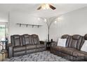 Inviting living room featuring plush leather seating, soft lighting, and a cozy atmosphere for relaxation at 301 Rowan Gq St, Salisbury, NC 28146