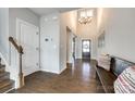 Grand foyer featuring hardwood floors, a soaring ceiling, and an inviting bench seating area at 3041 Winged Teal Ct, Belmont, NC 28012