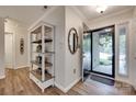 Entryway features wood-look floors, shelving, and a decorative mirror, creating a warm welcome at 353 Tall Oaks Trl, Fort Mill, SC 29715