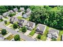 An aerial view shows the layout of the neighborhood and the home's placement in the community at 112 E Heart Pine Ln, Statesville, NC 28677