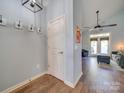 Bright entryway with hardwood floors, coat hooks, and seamless access to the living area at 120 Prairie View Ct, Belmont, NC 28012