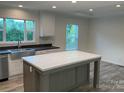 Spacious kitchen with a large center island, stainless steel appliances, and stylish countertops at 138 Zircon Dr, Statesville, NC 28625