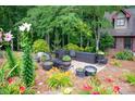 Inviting backyard patio with comfortable seating amidst lush greenery, perfect for outdoor relaxation at 169 Primrose Ln, Statesville, NC 28625