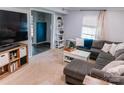 Comfortable living room features a large sectional sofa, bright window, and stylish decor at 1699 Riverdale Dr, Rock Hill, SC 29732