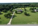 Expansive property showcasing a well-maintained home and sprawling lawn, perfect for outdoor activities at 212 Countryside Rd, Kings Mountain, NC 28086