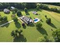 Aerial view of the property featuring a well-maintained in-ground pool, outbuildings and a large yard at 212 Countryside Rd, Kings Mountain, NC 28086