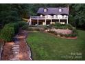 Charming two-story home featuring a spacious deck and professionally landscaped yard at 369 Skyland Ct, Mount Gilead, NC 27306