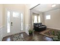 Bright entryway showcasing hardwood floors, a decorative glass door, and a cozy seating area at 398 Hampton Trail Dr # 97, Fort Mill, SC 29708
