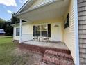 Inviting front porch with seating, showcasing the home's entrance and charming curb appeal at 40287 Palmerville Rd, New London, NC 28127