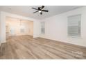Open concept living area with lots of natural light and wood-look floors at 4038 Jenison Valley Ct, Charlotte, NC 28214