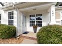 Inviting covered porch with a large window, brick-lined base, and a welcoming entryway at 409 Lexie Ln, Rock Hill, SC 29732
