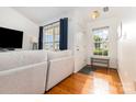 Bright living room with hardwood floors, natural light, and a view of the front yard at 409 Lexie Ln, Rock Hill, SC 29732