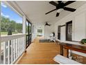 Spacious porch with ceiling fan, seating, and backyard views at 515 N Main Gq St, Granite Quarry, NC 28146