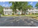 Townhouses with trees in front on a sunny day at 5226 Fair Wind Ln, Charlotte, NC 28212