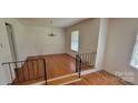 Inviting dining room area with hardwood flooring and a classic chandelier at 7017 Knightswood Dr, Charlotte, NC 28226