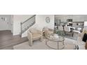 Open-concept living area with staircase, comfortable seating, and modern decor, blending style and functionality at 1043 20Th Avenue Se Loop, Hickory, NC 28602