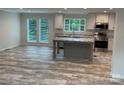 Open kitchen featuring a center island, modern appliances, and lots of windows at 130 Zircon Dr, Statesville, NC 28625