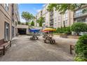 Inviting courtyard featuring picnic tables and lush greenery, creating a relaxing communal space at 1315 East Blvd, Charlotte, NC 28203