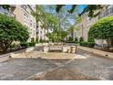 Scenic courtyard with lush greenery, well-maintained landscaping, and inviting benches at 1315 East Blvd, Charlotte, NC 28203
