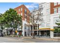 Building exterior featuring modern design elements with balconies and adjacent businesses along the street at 1315 East Blvd, Charlotte, NC 28203