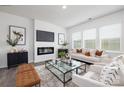 Sunlit living room featuring a modern fireplace, flat screen TV, and elegant decor with lots of natural light at 219 Parker Claire Ln, Kings Mountain, NC 28086